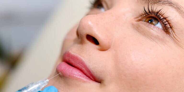 Woman getting lip filler